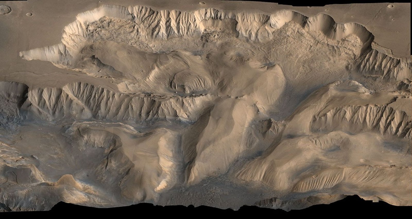 Mars: The Planet That Lost Its Oceans Valles Marineris canyon system on Mars in a real NASA Viking Orbiter mosaic, showing a vast reddish rift stretching across the planet's surface