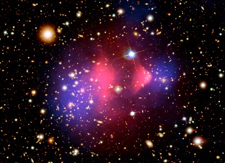 Dark Matter Might Not Be Matter at All: Inside the Theory That Gravity Is Leaking From a Parallel Universe The Bullet Cluster, showing visible gas in pink separated from the gravitational mass map in blue, among the strongest evidence for dark matter