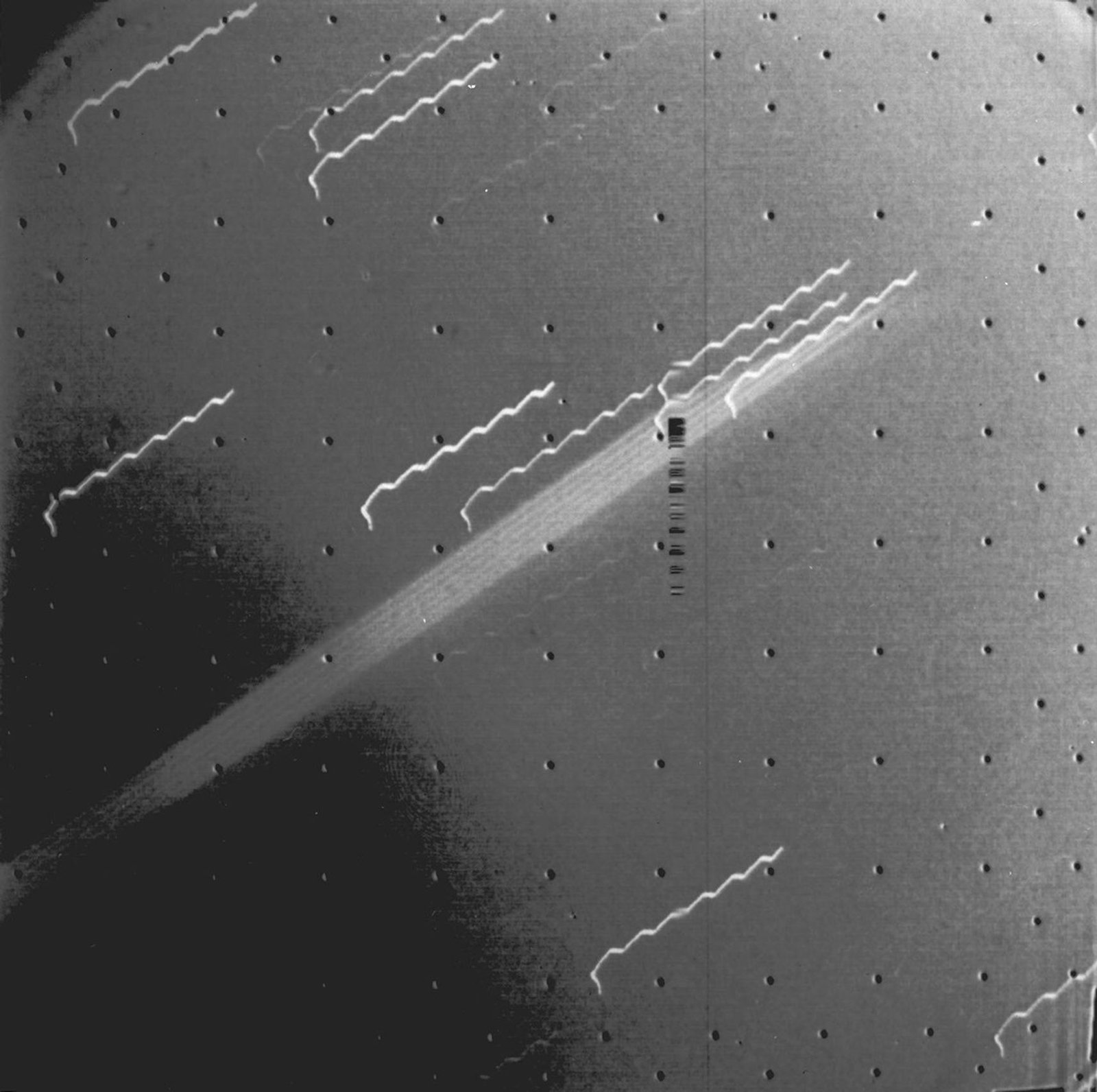 Jupiter: The Planet That Never Stopped Forming Real NASA Voyager 1 photograph from 1979 showing the first photographic evidence of Jupiter's faint ring system as a thin band of light